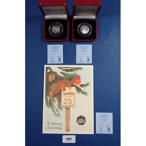 689 - Three Pobjoy Mint Isle of Man silver proof Christmas fifty pences 2000 and 2002 cased plus 2001 moun... 