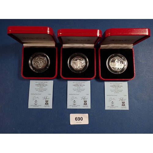 690 - Three Pobjoy Mint Isle of Man silver proof Christmas fifty pences, 1994, 1995 and 1996, all cased Co... 