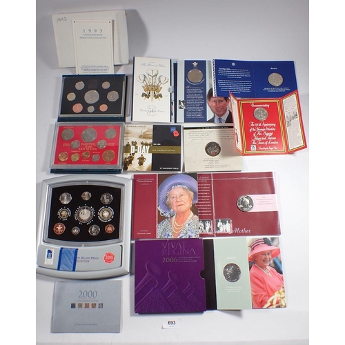 693 - A collection of commemorative coin sets including Royal Mint issues 1993 proof coin set, 1998 Prince... 