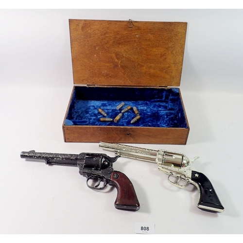 808 - Two toy revolvers and fake bullets - Rustler 45 and Lone Star Range Rider MK II