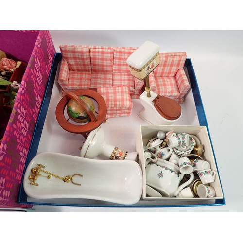 822 - A box of various dolls house furniture including china bathroom set, wire work conservatory table an... 