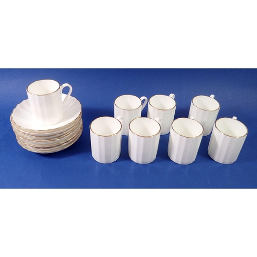 83 - A set of eight Worcester white coffee cups and saucers