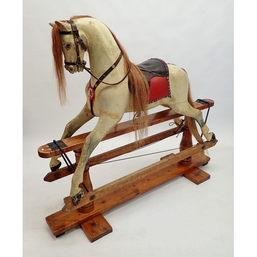 835 - A Victorian Ayres style painted wooden full size rocking horse on turned wood safety stand, 131cm ta... 