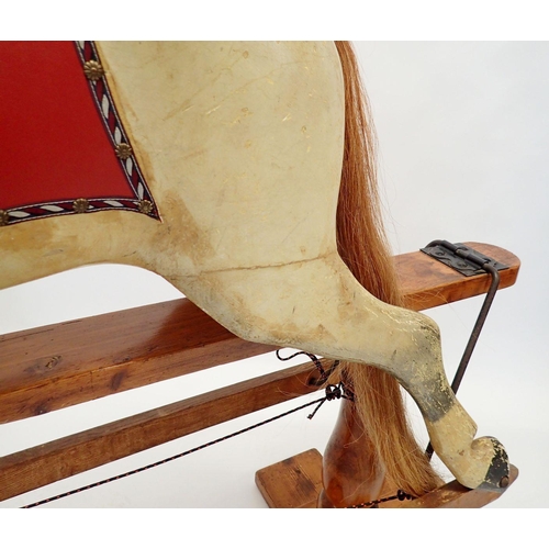 835 - A Victorian Ayres style painted wooden full size rocking horse on turned wood safety stand, 131cm ta... 