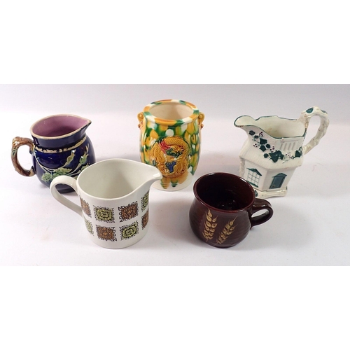 88 - A Victorian Majolica jug, a Majolica glazed pot and three other jugs