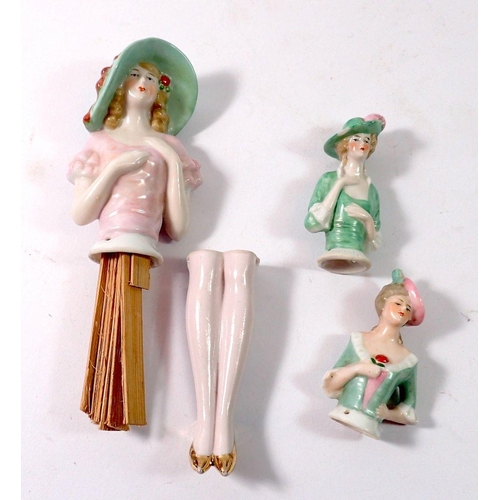 93 - Three vintage porcelain pin dolls including one with legs