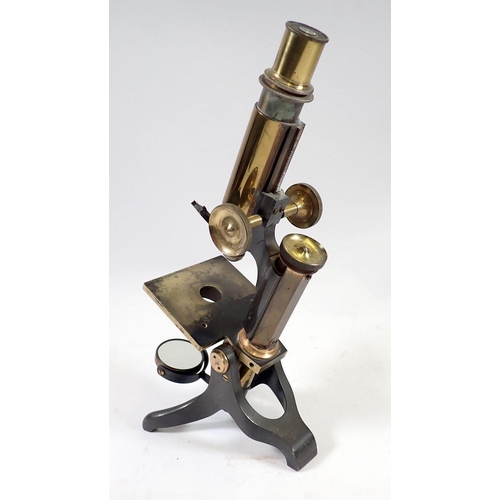 945 - An early 20th century brass monocular microscope by Baker, Holbourne, London