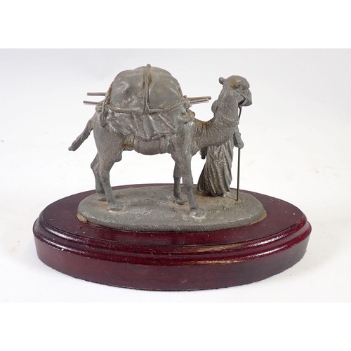 959 - A spelter model of a Middle Eastern man and camel, 19cm wide