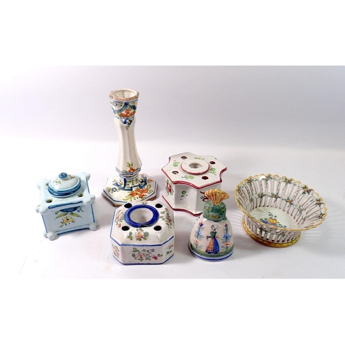 96 - A group of tin glazed earthenware including three inkwells, bell, candlestick etc.