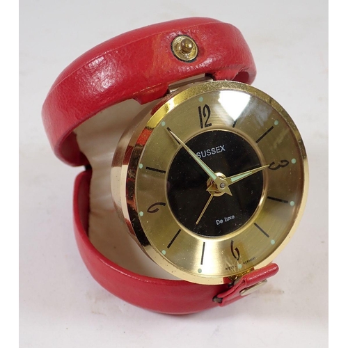 967 - A Sussex De Luxe vintage travel clock in original red leather case