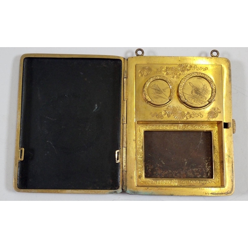 978 - A Japanese Meiji period Komai gilded metal evening purse with two sovereign holders, compact and cha... 