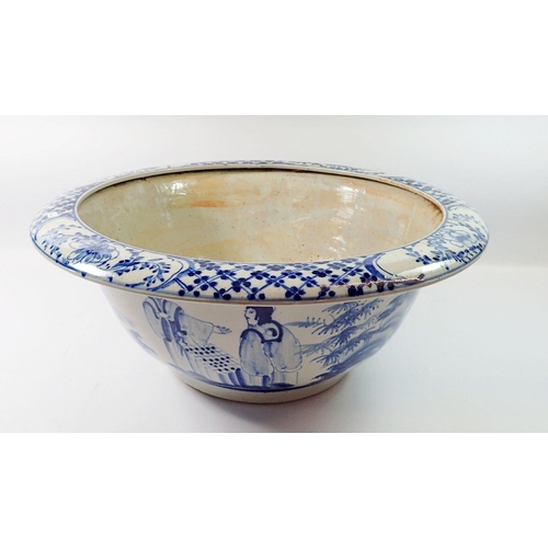 99 - A modern Chinese large blue and white bowl decorated figures in landscape, 51cm diameter