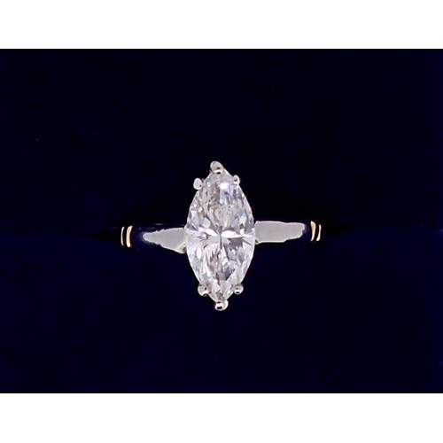 402 - An 18 carat gold and platinum set marquise cut diamond ring, approximately one carat, size L, boxed