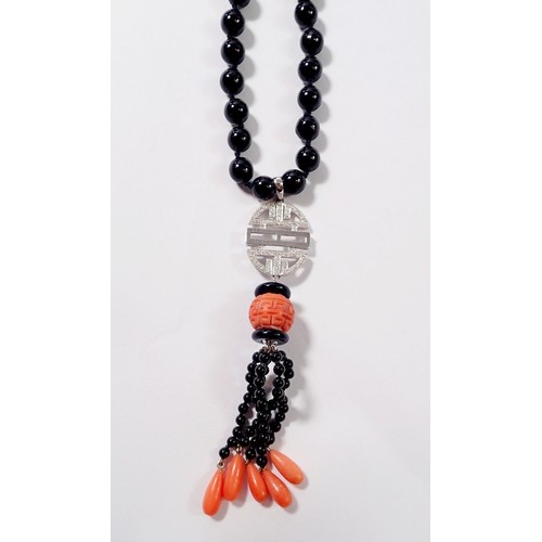 444 - An Art Deco style 15ct white gold onyx and coral bead necklace with diamond set geometric drop  and ... 