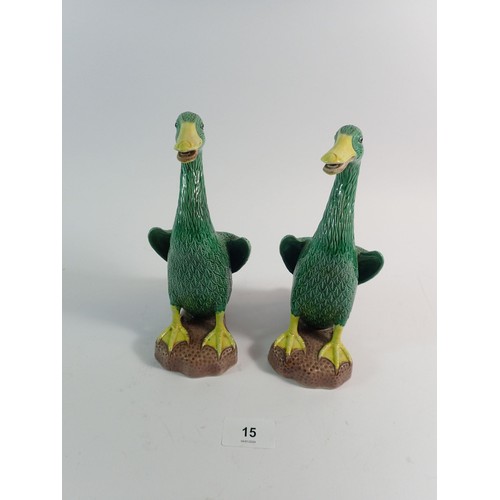 15 - A pair of Chinese glazed pottery ducks, 21cm high