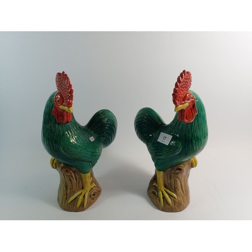 17 - A pair of Chinese glazed pottery cockerels 32cm tall