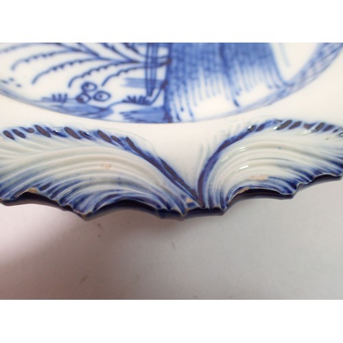 62 - A 19th century Pearlware plate painted Chinese landscape and figure and leaf swag border, 21.5cm dia... 