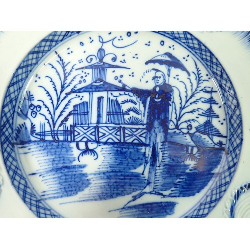 62 - A 19th century Pearlware plate painted Chinese landscape and figure and leaf swag border, 21.5cm dia... 