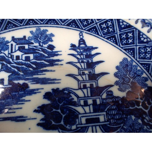 62 - A 19th century Pearlware plate painted Chinese landscape and figure and leaf swag border, 21.5cm dia... 