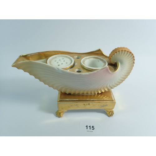 115 - A 19th century shell form gilt and cream inkwell, 13cm tall, 19cm wide