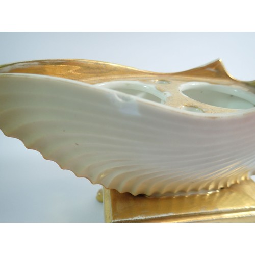 115 - A 19th century shell form gilt and cream inkwell, 13cm tall, 19cm wide