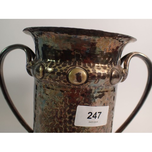 247 - A silver plated Arts & Crafts hammered bottle holder