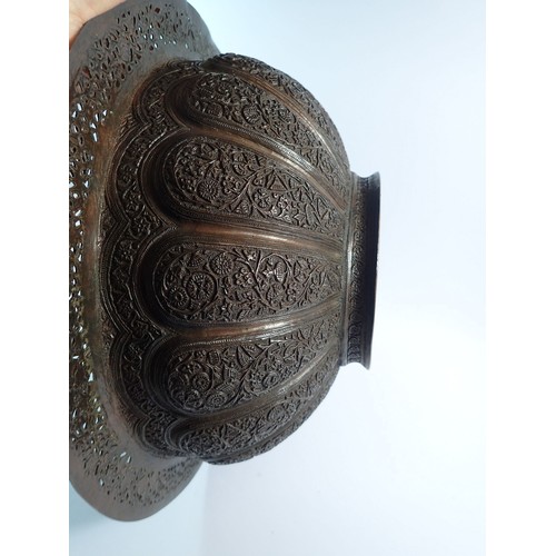 1252 - A large Indian copper brazier bowl with pierced rim and cast floral decoration, 40.5cm diameter