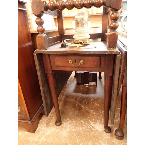 1330 - An 18th century oak dropleaf dining table with end drawer and pad feet, 52 x 112cm