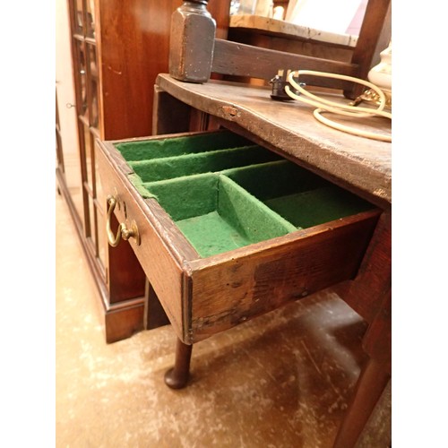 1330 - An 18th century oak dropleaf dining table with end drawer and pad feet, 52 x 112cm