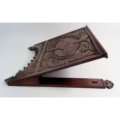 1002 - A carved oak wall magazine rack, 35 x 44cm