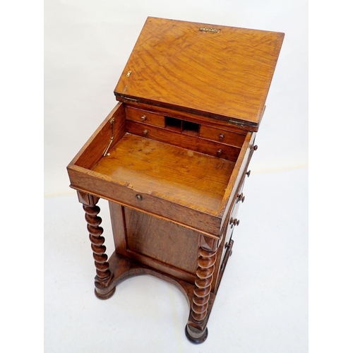 1003 - A Victorian oak Davenport desk with spiral turned supports, 54cm wide