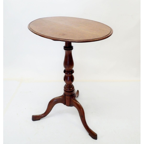 1005 - A 19th century oak oval tilt top wine table on carved and turned column with triple supports, 45 x 5... 