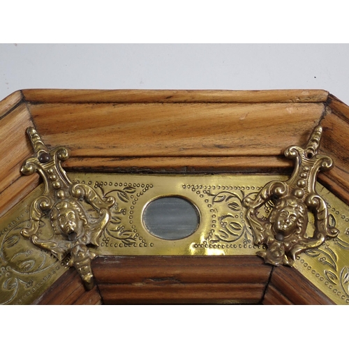 1008 - A continental wall mirror with stone and brass inset to satin walnut, 52 x 41cm