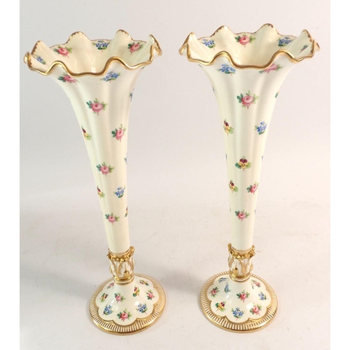 102 - A pair of Minton trumpet form vases with frilled rims painted roses, pansies and forget me nots with... 