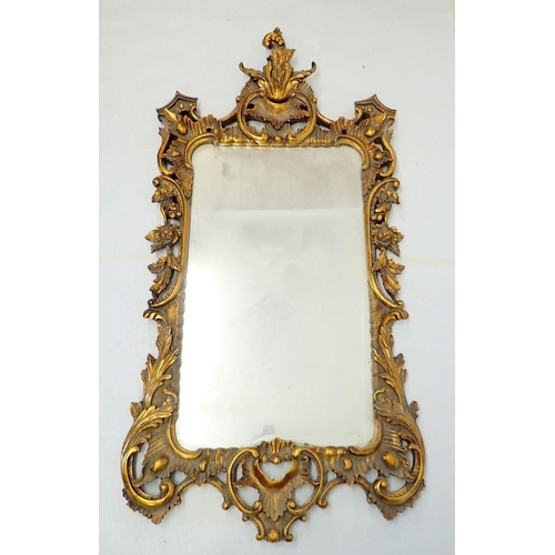 1034 - A large antique style floral and scrollwork gilt framed mirror, 154 x 77cm