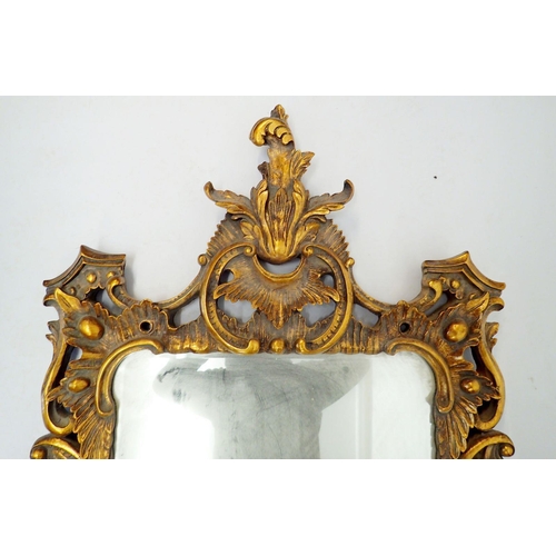 1034 - A large antique style floral and scrollwork gilt framed mirror, 154 x 77cm