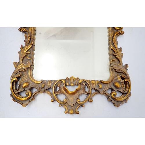 1034 - A large antique style floral and scrollwork gilt framed mirror, 154 x 77cm