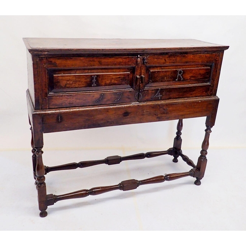 1038 - An 18th century small cabinet on stand dated 1764 raised on turned stratchers and with beaded IR mon... 