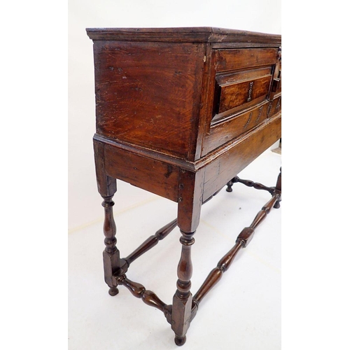 1038 - An 18th century small cabinet on stand dated 1764 raised on turned stratchers and with beaded IR mon... 