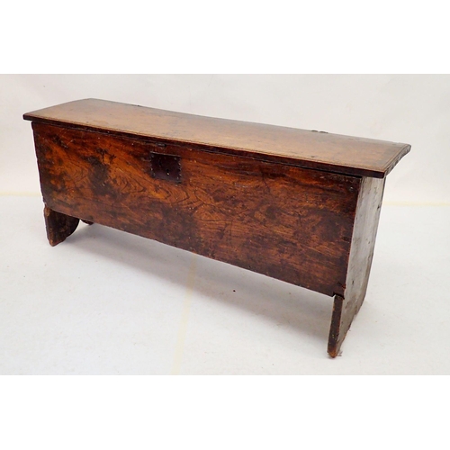 1044 - A 17th century elm coffer on split end supports, 125 x 36 x 52cm