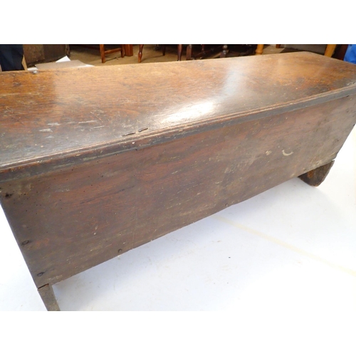 1044 - A 17th century elm coffer on split end supports, 125 x 36 x 52cm