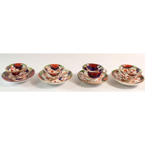 107 - A 19th century Gaudy Welsh set of four miniature cups and saucers (one saucer a/f)