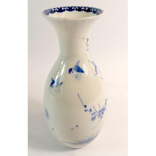 118 - A Japanese blue and white vase painted flowers and trees with two birds, 23cm