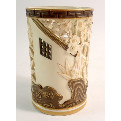 129 - A Royal Worcester Japanese style reticulated vase in ivory and gilt with bamboo and tree decoration,... 