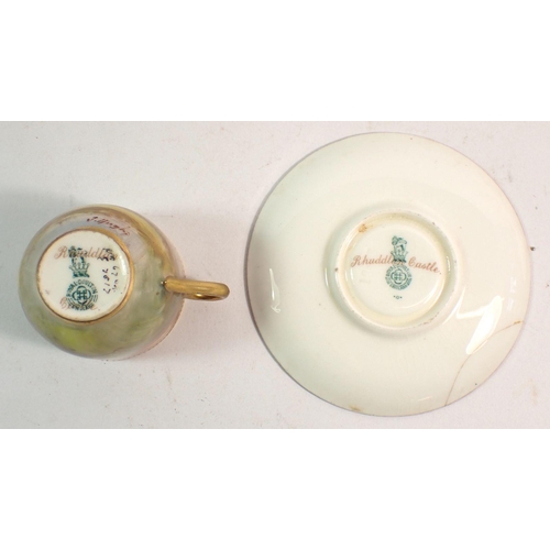 143 - A Royal Doulton small cabinet cup and saucer painted Rhuddlan Castle, signed John Hughes - saucer a/... 