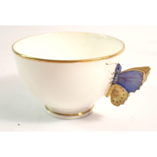 144 - A Worcester teacup with butterfly handle and two floral painted Worcester teacups - all without sauc... 