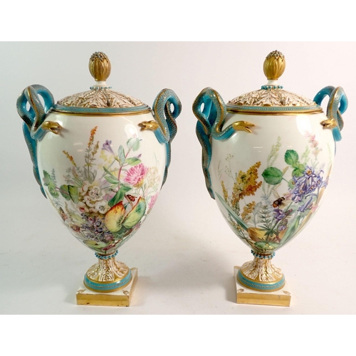 147 - A pair of Royal Worcester pot pourri vases and covers, the pierced foliage covers with flower bud fi... 