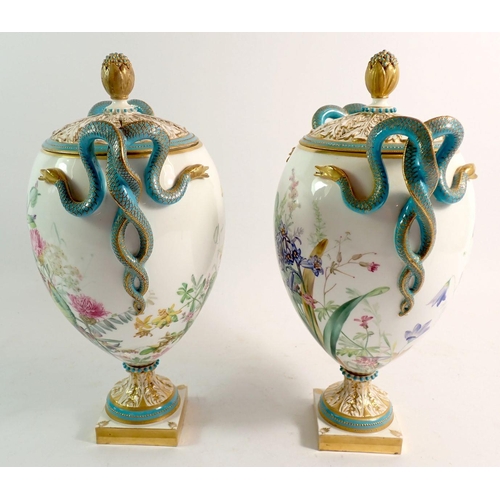 147 - A pair of Royal Worcester pot pourri vases and covers, the pierced foliage covers with flower bud fi... 