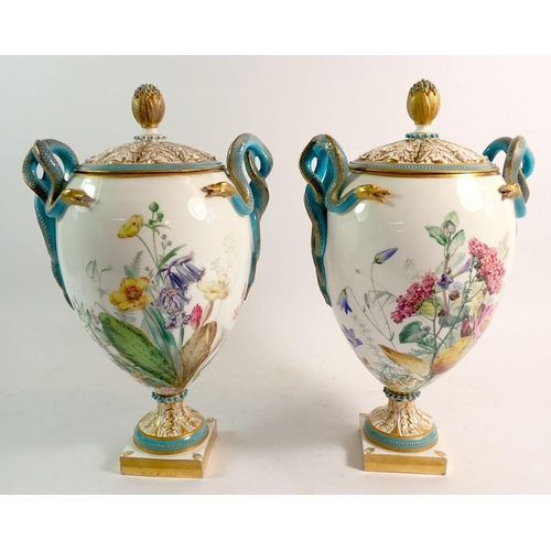 147 - A pair of Royal Worcester pot pourri vases and covers, the pierced foliage covers with flower bud fi... 