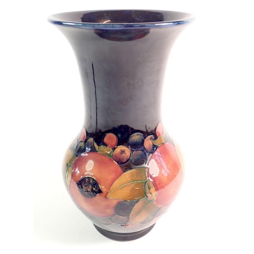 150 - A Moorcroft Pomegranate vase on blue ground, 25cm